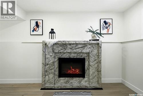 96 Bobolink Bay, Regina, SK - Indoor Photo Showing Living Room With Fireplace