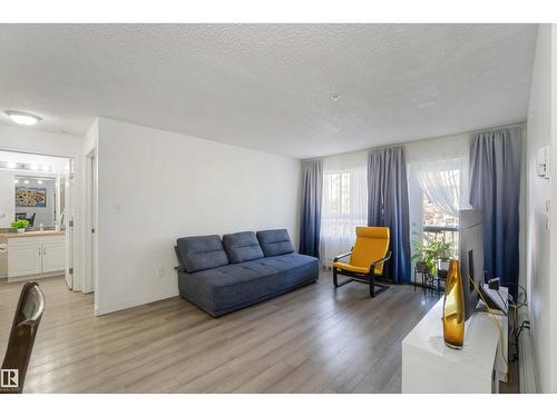 #324 5350 199 St Nw, Edmonton, AB - Indoor Photo Showing Living Room