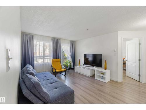 #324 5350 199 St Nw, Edmonton, AB - Indoor Photo Showing Living Room