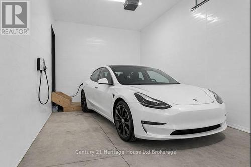 Virtually Staged - 606 - 361 Quarter Town Line, Tillsonburg, ON - Indoor Photo Showing Garage
