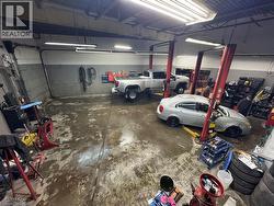 Garage featuring concrete block wall - 