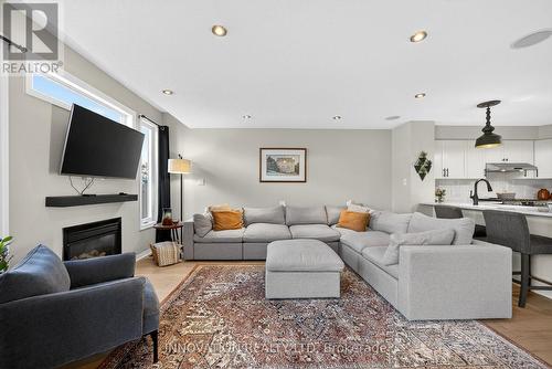 23 Abaca Way, Ottawa, ON - Indoor Photo Showing Living Room With Fireplace