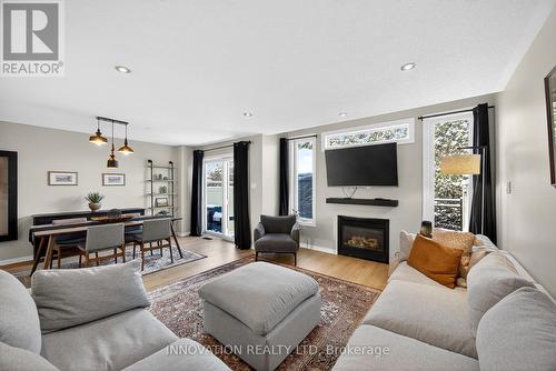 23 Abaca Way, Ottawa, ON - Indoor Photo Showing Living Room With Fireplace