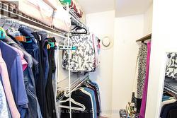 Closet organizer in walk-in closet - 