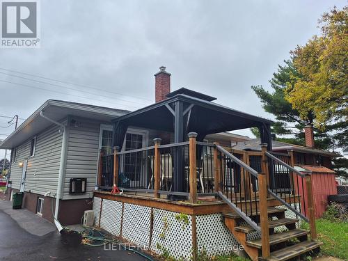 SIDE & REAR OF HOUSE WITH DECK - 823 Bedford Street N, Cornwall, ON - Outdoor With Deck Patio Veranda