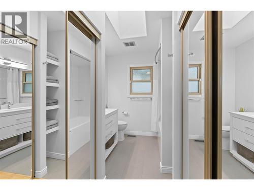 Walk thru closet in primary bedroom - 11609 Upper Summit Drive, Coldstream, BC - Indoor
