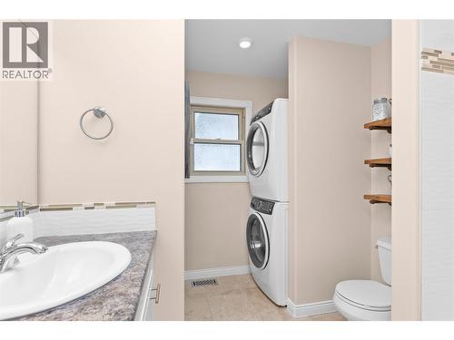 Laundry in main bathroom - 11609 Upper Summit Drive, Coldstream, BC - Indoor Photo Showing Laundry Room