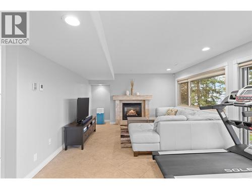 Rec room in basement - 11609 Upper Summit Drive, Coldstream, BC - Indoor With Fireplace