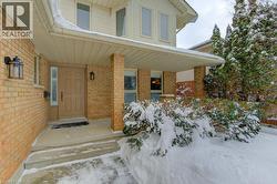 Covered front porch with brick pillars - 