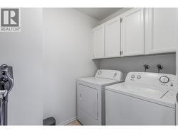 Spacious in Unit Laundry Room with Cabinets - 