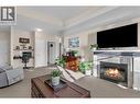 660 Lequime Road Unit# 405, Kelowna, BC  - Indoor Photo Showing Living Room With Fireplace 