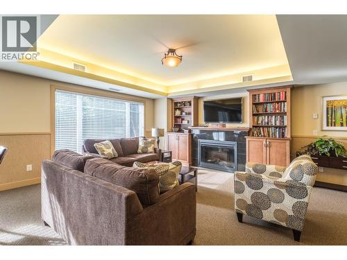 660 Lequime Road Unit# 405, Kelowna, BC - Indoor Photo Showing Living Room With Fireplace