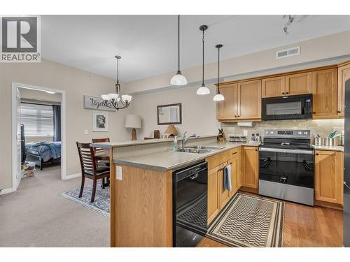 660 Lequime Road Unit# 405, Kelowna, BC - Indoor Photo Showing Kitchen With Double Sink