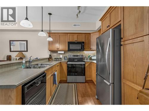 660 Lequime Road Unit# 405, Kelowna, BC - Indoor Photo Showing Kitchen With Double Sink