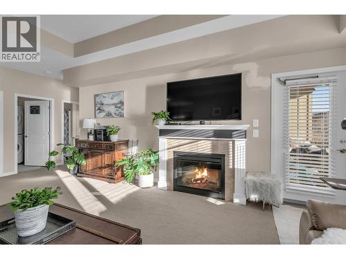 660 Lequime Road Unit# 405, Kelowna, BC - Indoor Photo Showing Living Room With Fireplace
