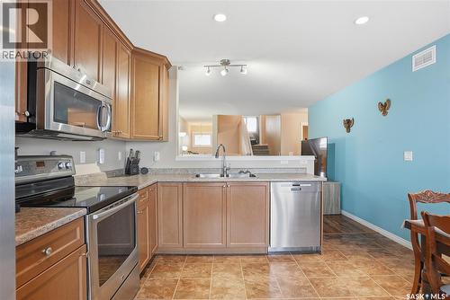 219 Henick Crescent, Saskatoon, SK - Indoor Photo Showing Kitchen With Double Sink