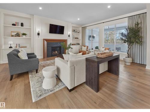 4183 Cameron Heights Pt Nw, Edmonton, AB - Indoor Photo Showing Living Room With Fireplace