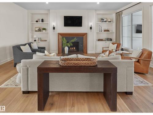 4183 Cameron Heights Pt Nw, Edmonton, AB - Indoor Photo Showing Living Room With Fireplace