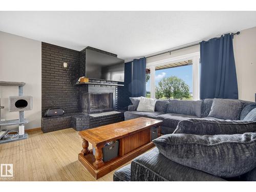 320 1 Av, Thorhild, AB - Indoor Photo Showing Living Room With Fireplace