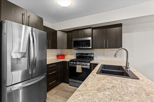 13-335 Gerstmar Road, Kelowna, BC - Indoor Photo Showing Kitchen With Double Sink