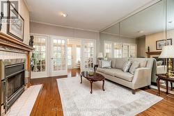 living room with doors to sunroom - 