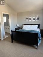 primary bedroom with vaulted ceilings - 