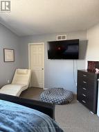 primary bedroom with  walk in closet - 