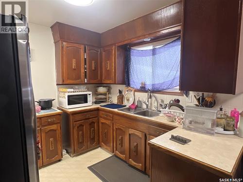 87 Merlin Crescent, Regina, SK - Indoor Photo Showing Kitchen With Double Sink