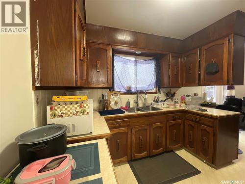 87 Merlin Crescent, Regina, SK - Indoor Photo Showing Kitchen With Double Sink