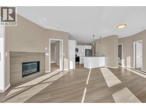 3362 Skaha Lake Road Unit# 203, Penticton, BC - Indoor Photo Showing Living Room With Fireplace