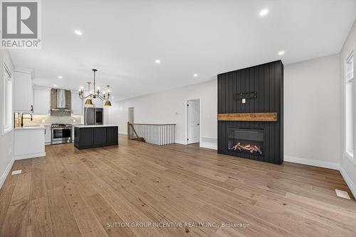 123 Ritchie Crescent, Springwater, ON - Indoor With Fireplace