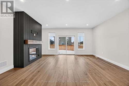 123 Ritchie Crescent, Springwater, ON - Indoor Photo Showing Living Room With Fireplace