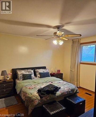 Bedroom featuring wood finished floors and a ceiling fan - 197 Craigroyston Road, Hamilton, ON - Indoor Photo Showing Bedroom