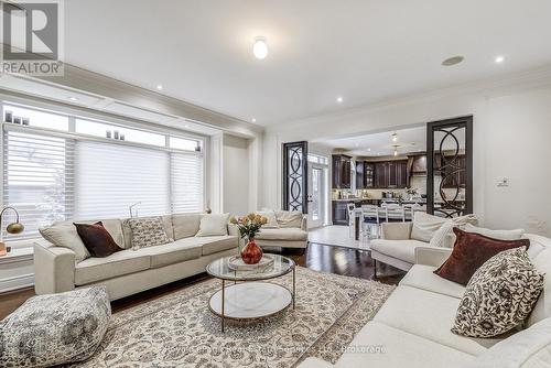 Wall to wall windows w/window seating - 2331 Rideau Drive, Oakville (Jc Joshua Creek), ON - Indoor Photo Showing Living Room