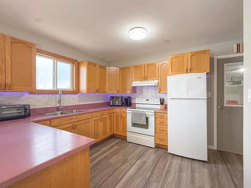 49084 Service Road, Brandon, MB - Indoor Photo Showing Kitchen With Double Sink