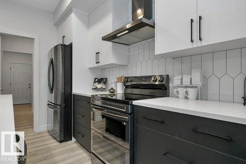 104 Bluff Cv, Leduc, AB - Indoor Photo Showing Kitchen