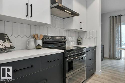 104 Bluff Cv, Leduc, AB - Indoor Photo Showing Kitchen
