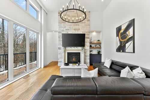 Salon - 62 Rue Monette, Saint-Hippolyte, QC - Indoor Photo Showing Living Room With Fireplace