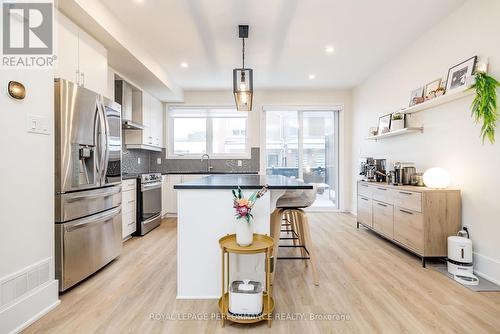 Open concept kitchen with eat-up island - 225 Makadewa Private, Ottawa, ON - Indoor Photo Showing Kitchen With Upgraded Kitchen