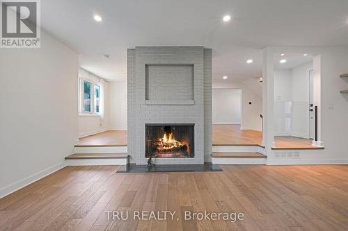 12 Apache Crescent, Ottawa, ON - Indoor Photo Showing Living Room With Fireplace