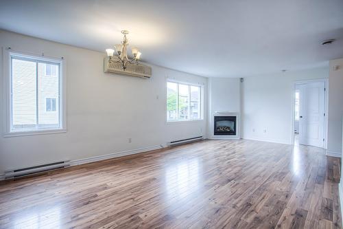 Salon - 4658 Rue Esther-Pariseau, Laval (Chomedey), QC - Indoor Photo Showing Living Room With Fireplace