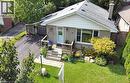 View of front facade featuring brick siding, a wooden deck, and a chimney - 33 Garland Crescent, London, ON  - Outdoor With Deck Patio Veranda 