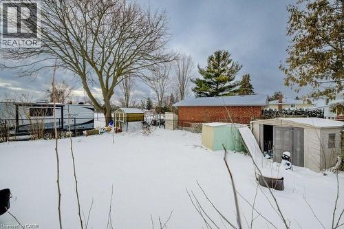 Yard layered in snow with a storage unit - 33 Garland Crescent, London, ON - Outdoor