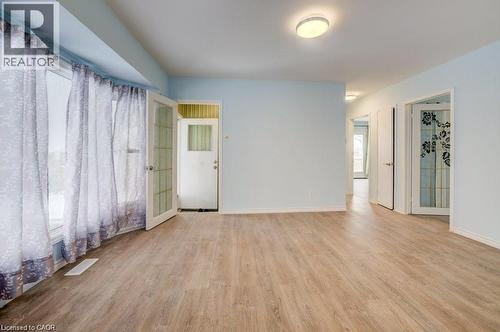 Empty room with plenty of natural light and light wood-style flooring - 33 Garland Crescent, London, ON - Indoor Photo Showing Other Room