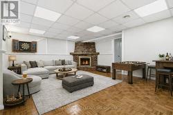Rec Rm with fireplace. AI staged furniture & fire. - 