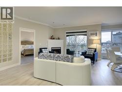 Living room to primary bedroom and dining area - 