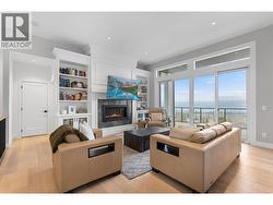 TV on adjustable arm with heat sensor for fireplace. - 