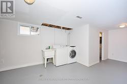 Laundry Area and door to 1pc Bathroom & rough-in - 