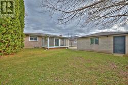 Backyard, sunroom and detached garage - 