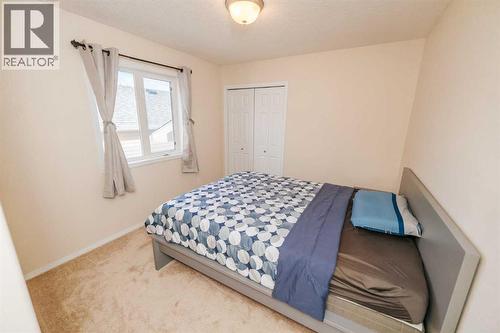 Main Floor - Bedroom 2 - 54 Kodiak Crescent N, Lethbridge, AB - Indoor Photo Showing Bedroom